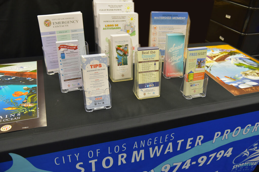 A number of educational materials offered through the "Booth in a Box" program on display atop a table.